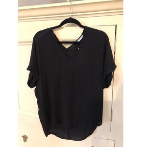 Francesca’s black blouse